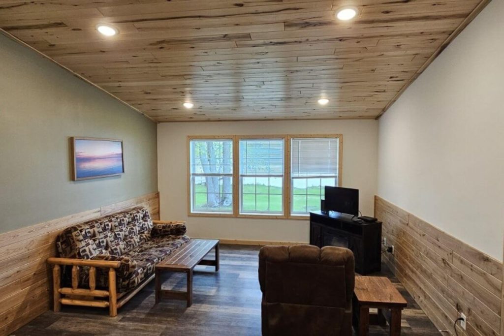 Cabin #4 Living Room with Log Futon Couch and Lakeviews-