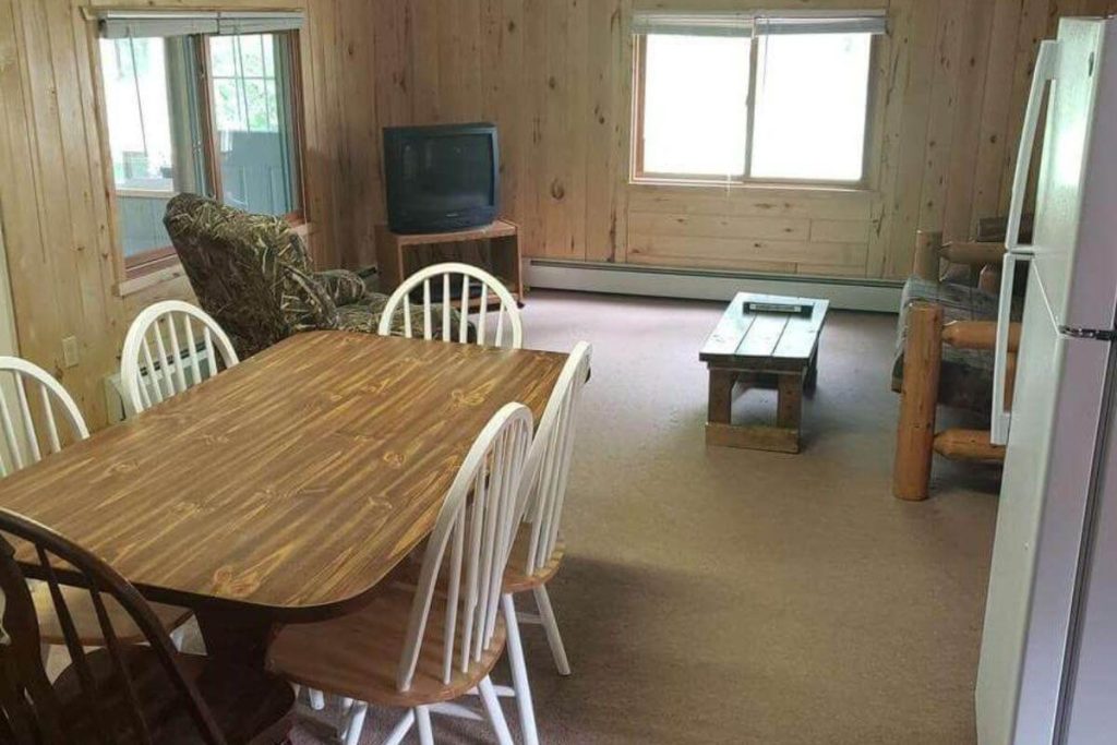 Cabin #14 - Dining Area and Living Room with Log Futon Couch