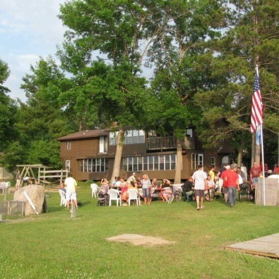 Resort Guests Gather for Drinks and Fun Outside of Allen's Bay Lodge & Grill