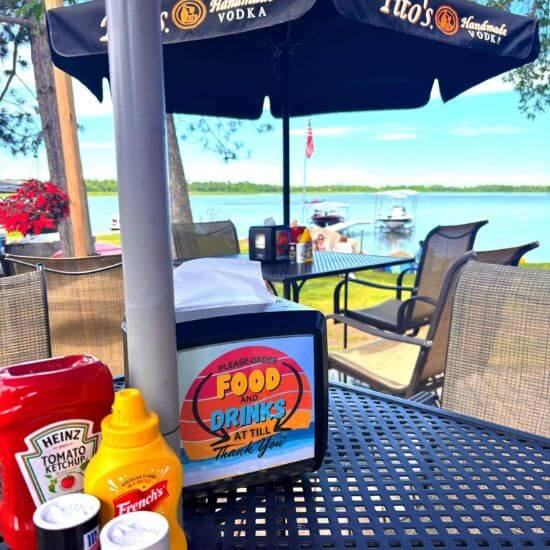 Outdoor Seating Available with Views of Cass Lake at Allen's Bay Lodge in Sunset Cove Resort