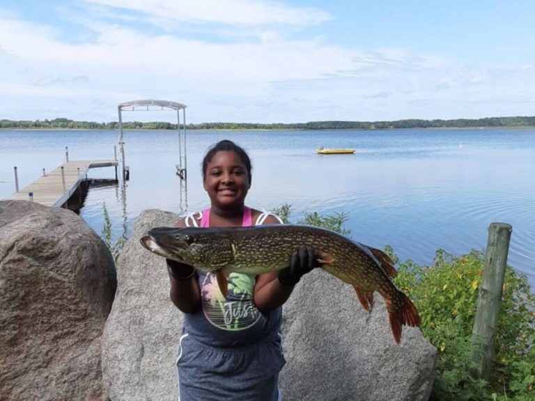 Young Angler Shows Off Her Catch Off the Dock at Sunset Cove Resort
