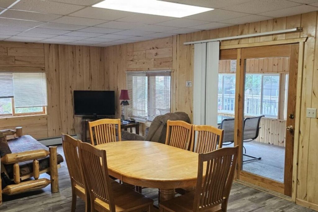 Cabin #11 - Living Room with Log Futon Couch and Dining Area
