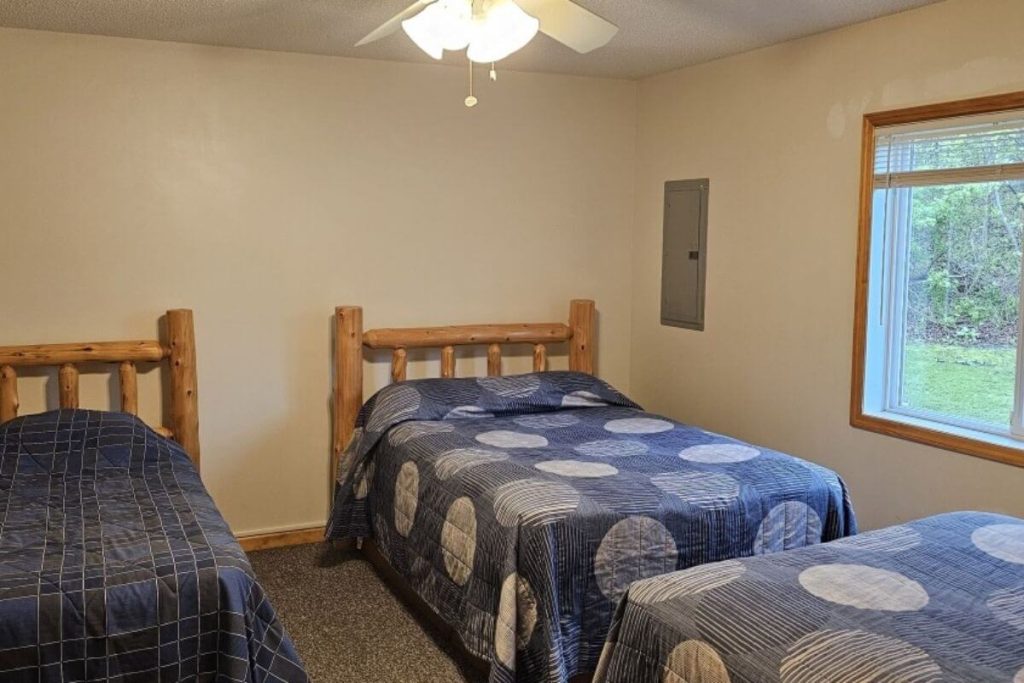 Cabin #16 - Bedroom #2 with Two Double Beds and Single Bed