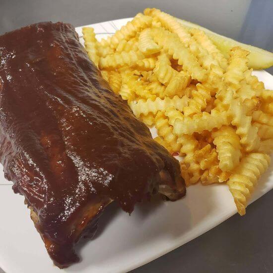 Rack of Ribs with Fries at Ruzy's Bar & Grill