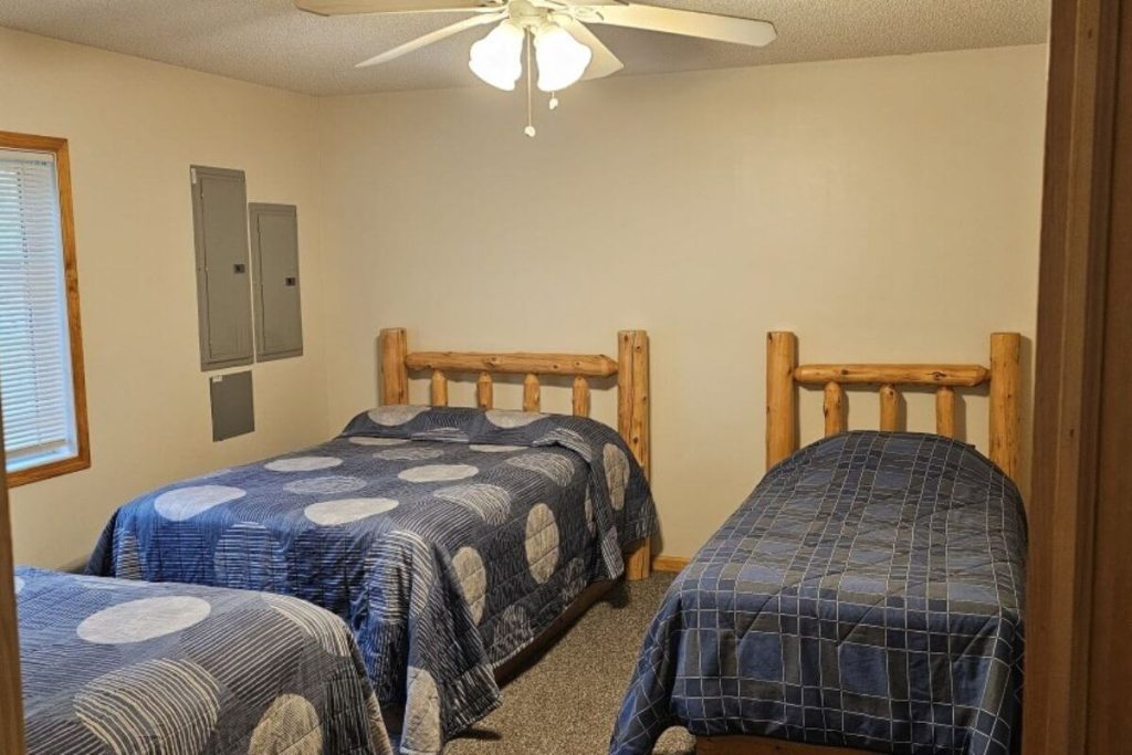 Cabin #15 - Bedroom #2 with Two Double Beds and a Single Bed