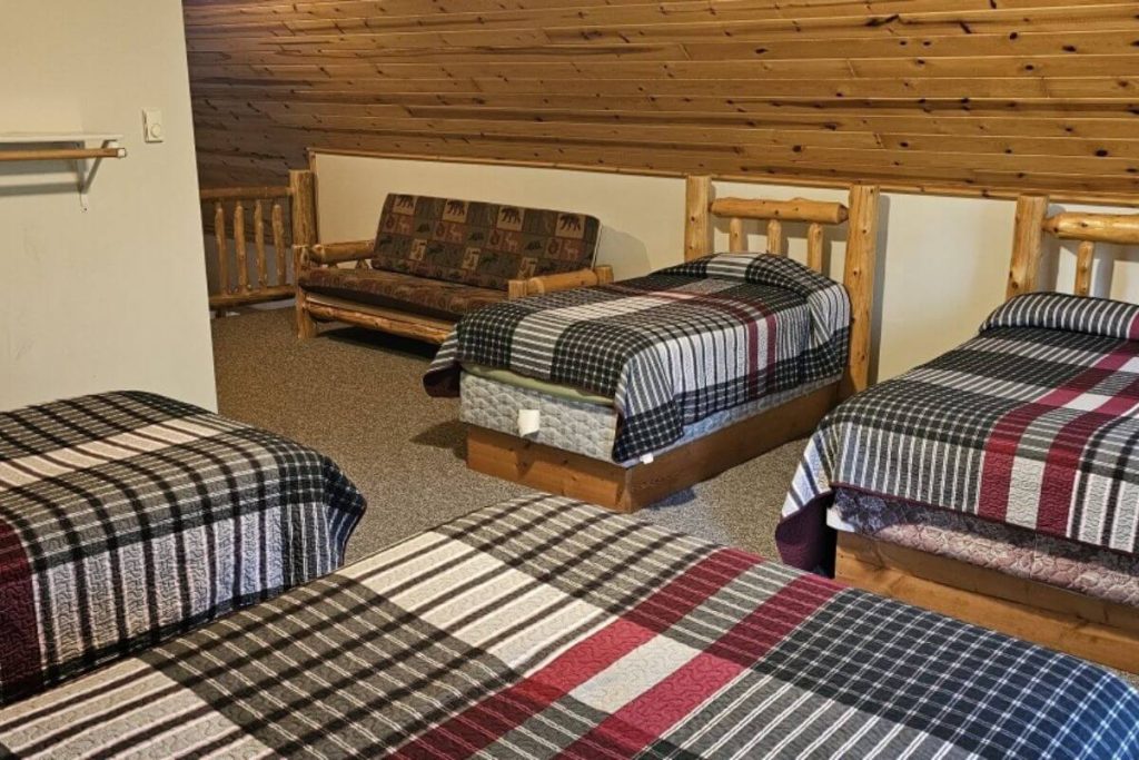 Cabin #18 - Loft Bedroom with Two Double Beds, Two Single Beds, and Log Futon Couch