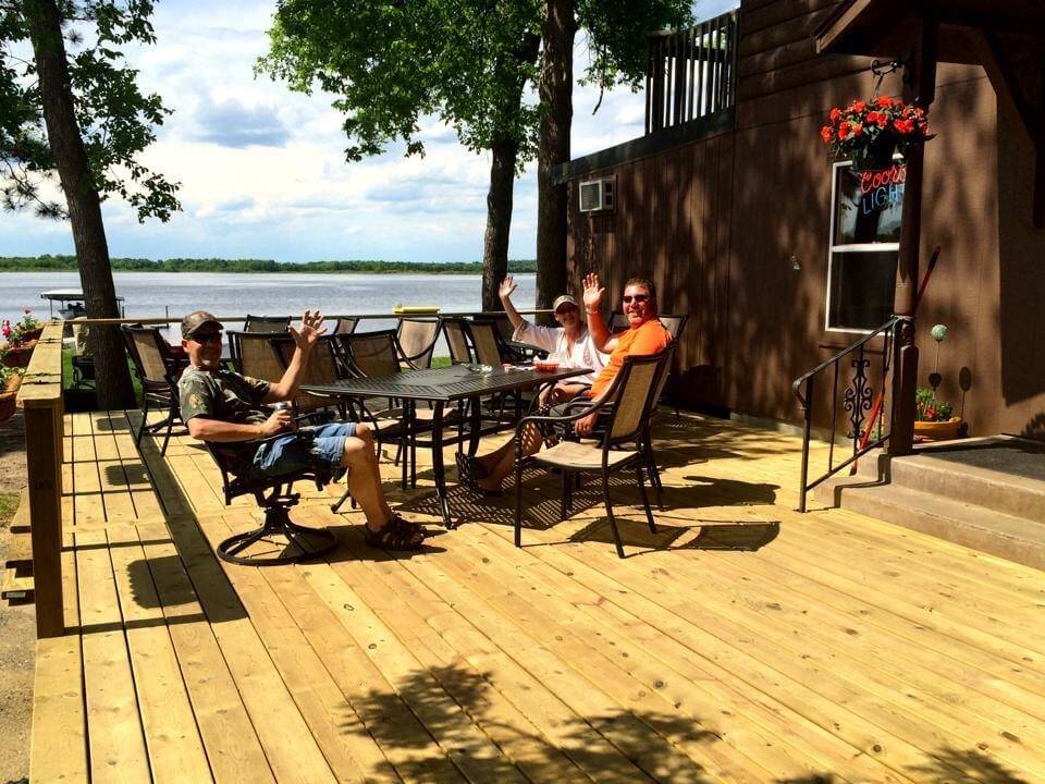 Sunset Cove Resort Guests Enjoy a Cold Drink and Lake Views at Allen's Bay Lodge and Grill
