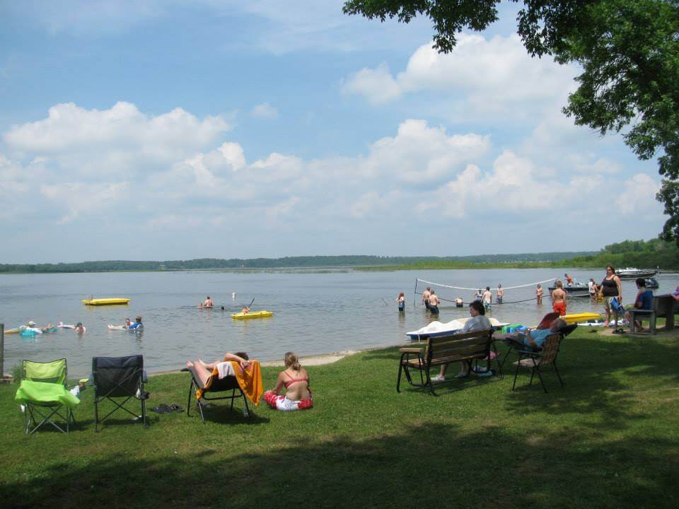 Resort Guests Relaxing at the Beach in Allens Bay
