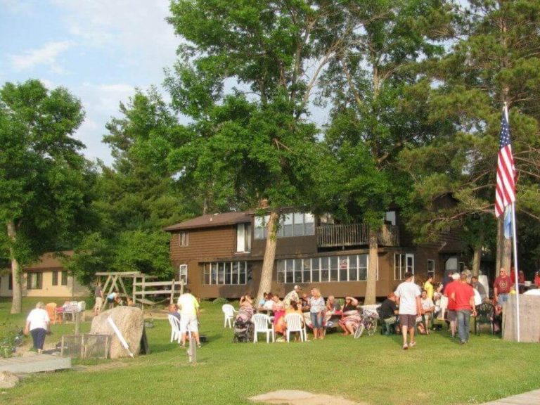 Sunset Cove Resort Patrons Enjoy a Sunny Afternoon in Front of Allen's Bay Lodge & Grill