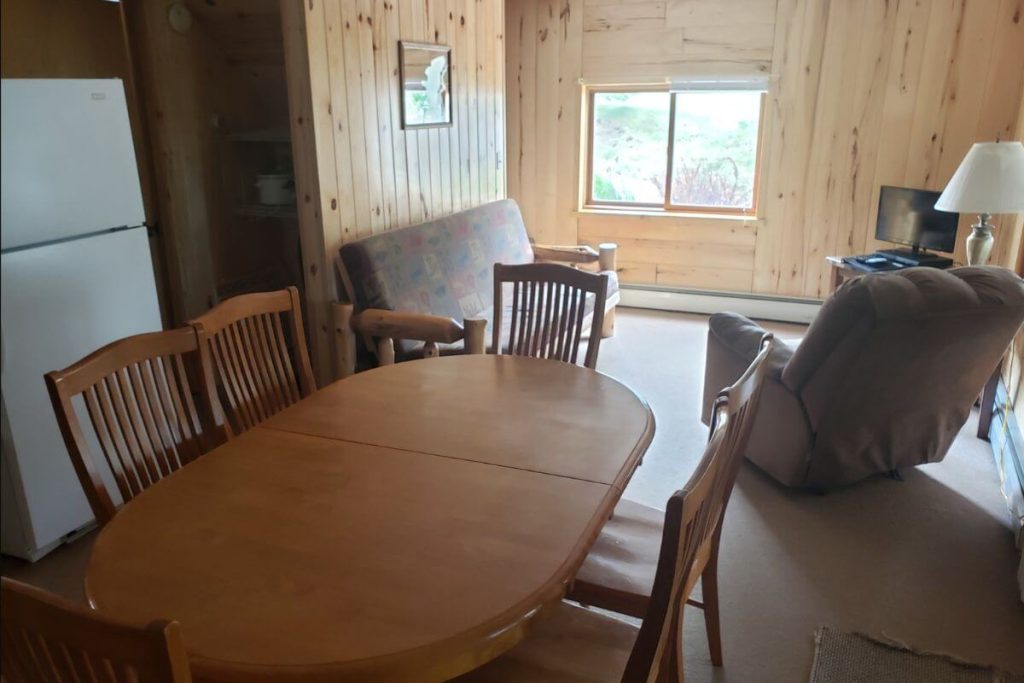 Cabin #11 - Living Room with Log Futon Couch and Dining Area